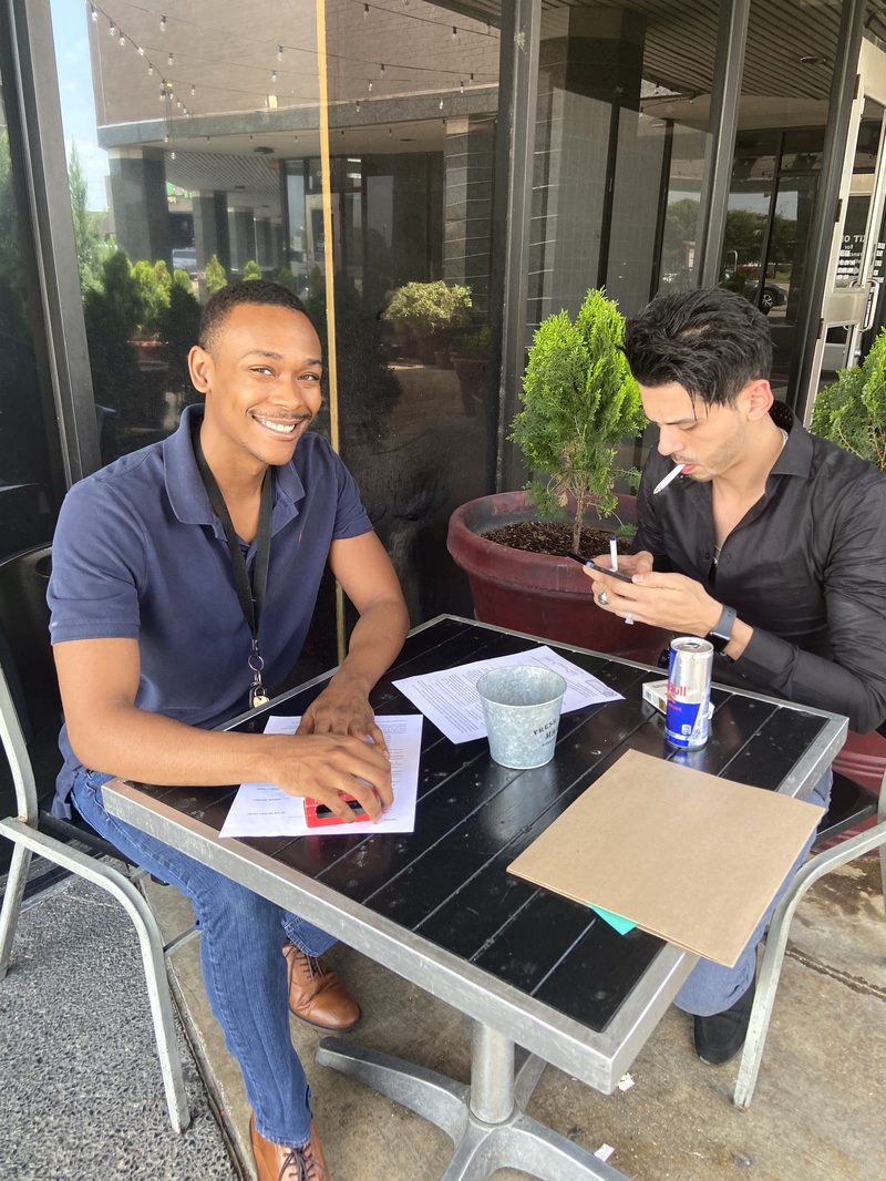 Mobile notary meeting a client outdoors in Houston
